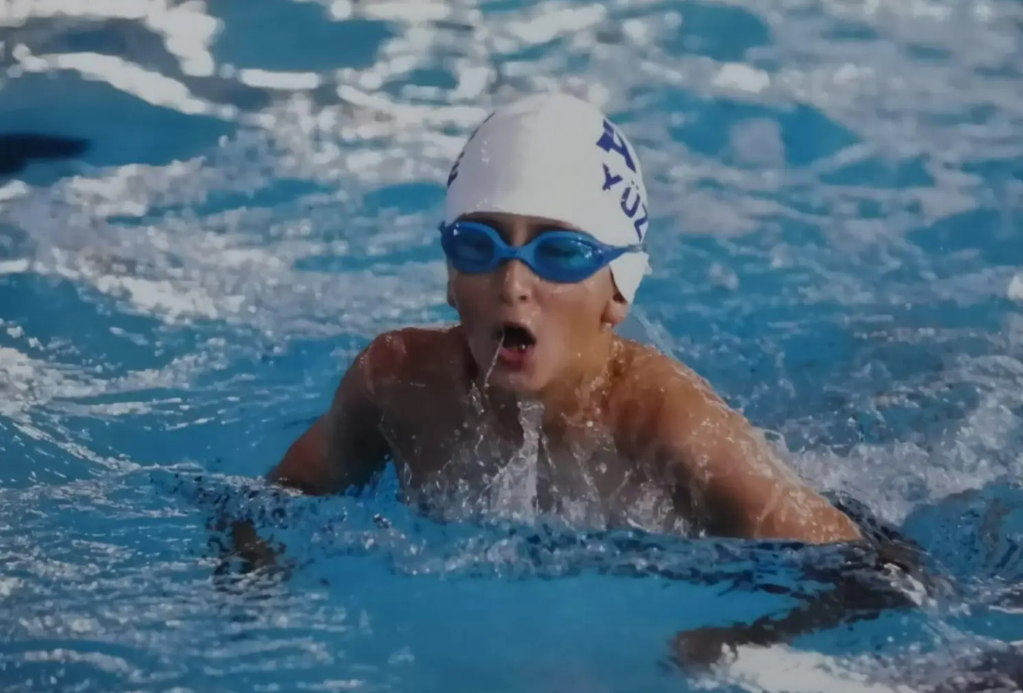 Athlete swimming breaststroke style