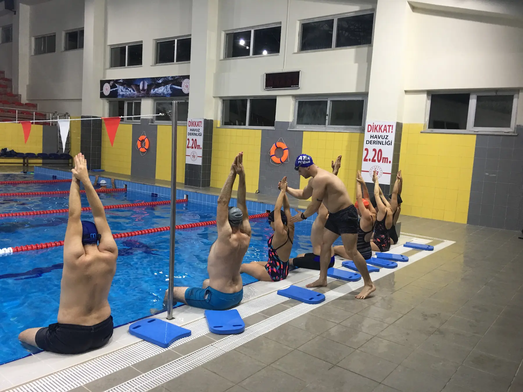 Adults warming up before class